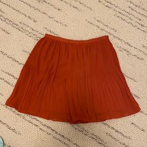 Urban Outfitters pleated orange mini skirt